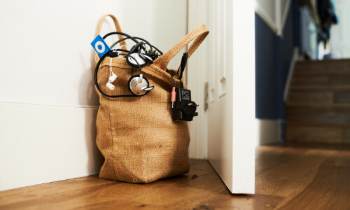 hessian bag full of electricals by a door