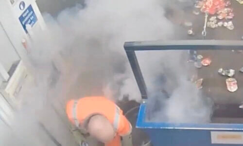 Worker finding safety after a battery fire started on his picketing line