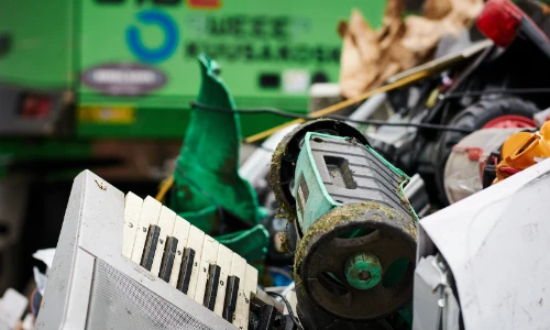 a close up of a container full of broken electrical goods