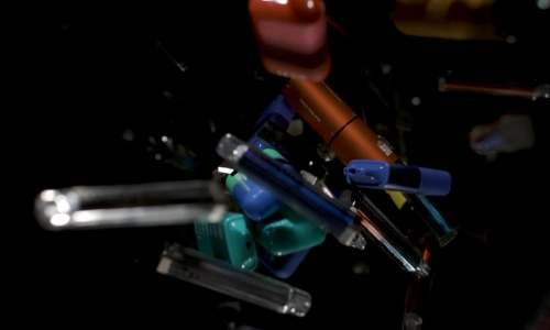 a close up of a few discarded single use vapes