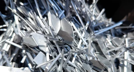 Photo shows a pile of sliver metal offcuts